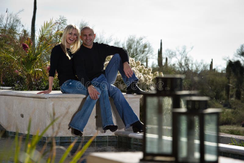 Laughing Couple by the Pool Stock Image Image of december, lovely