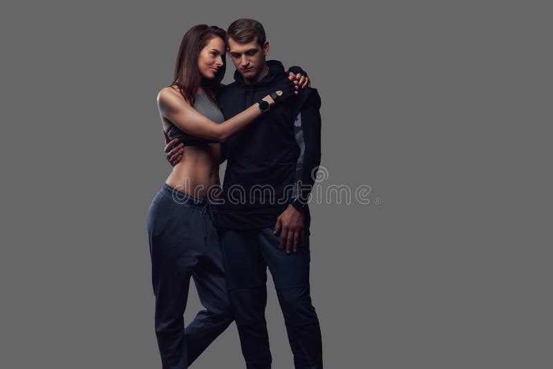 Slim woman looking at camera and holding hand to hand Stock Photo by  fxquadro