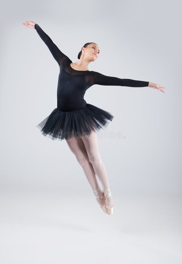 Attractive dancer jumping and practicing dance. stock image