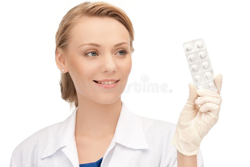 Attractive female doctor with pills