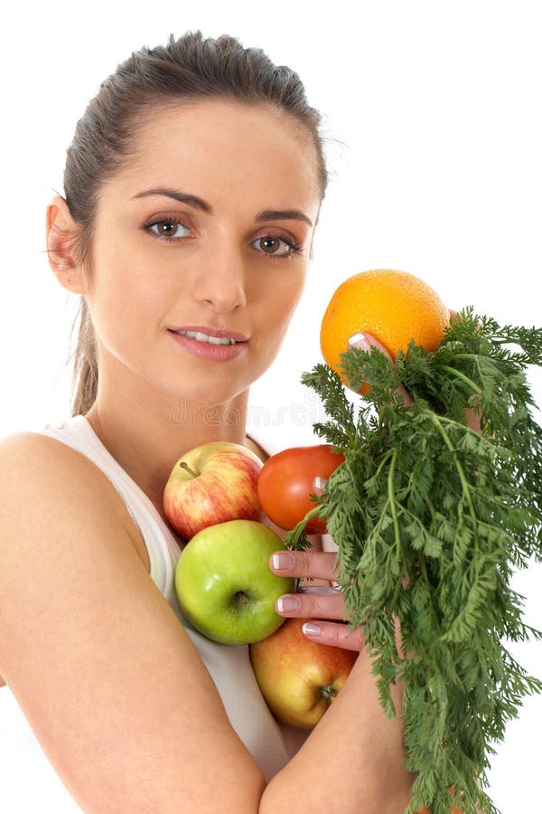 Attractive female holds bunch of fruit and veg