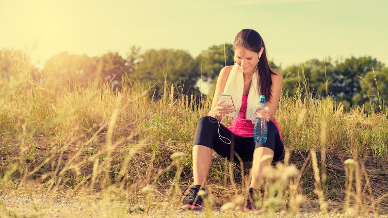 Attractive Female Taking A Break After Jogging Stock I