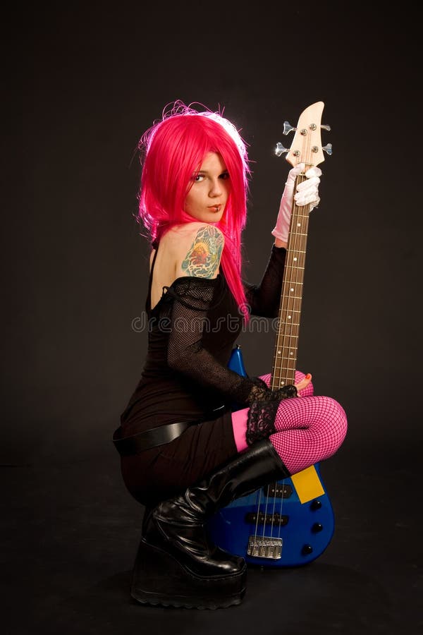 Attractive girl with bass guitar