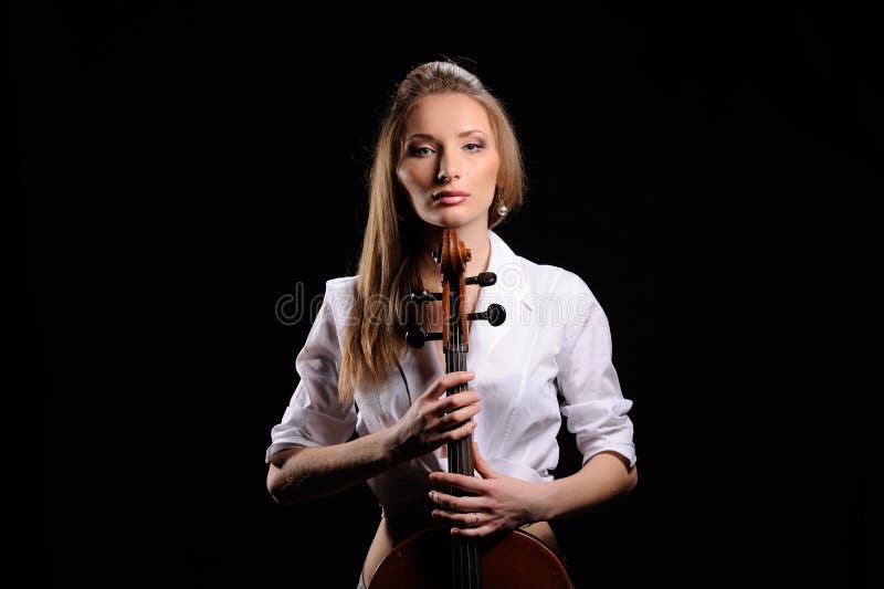 attractive girl with cello isolated over black background