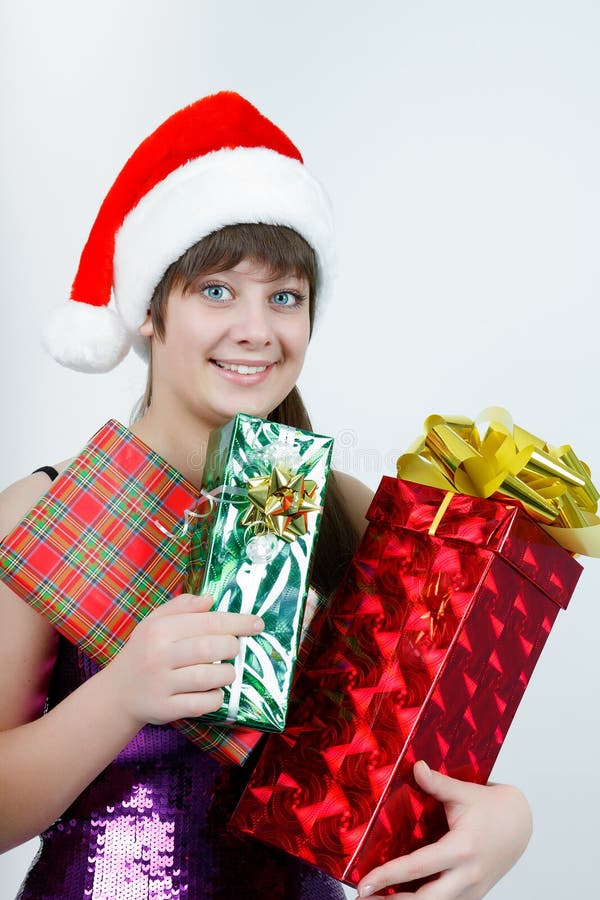 Attractive Girl in a Christmas Hat with Gift Boxes Stock Image Image
