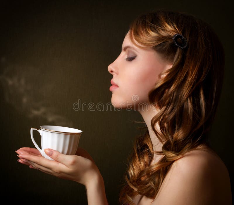 Attractive girl with a cup of coffee