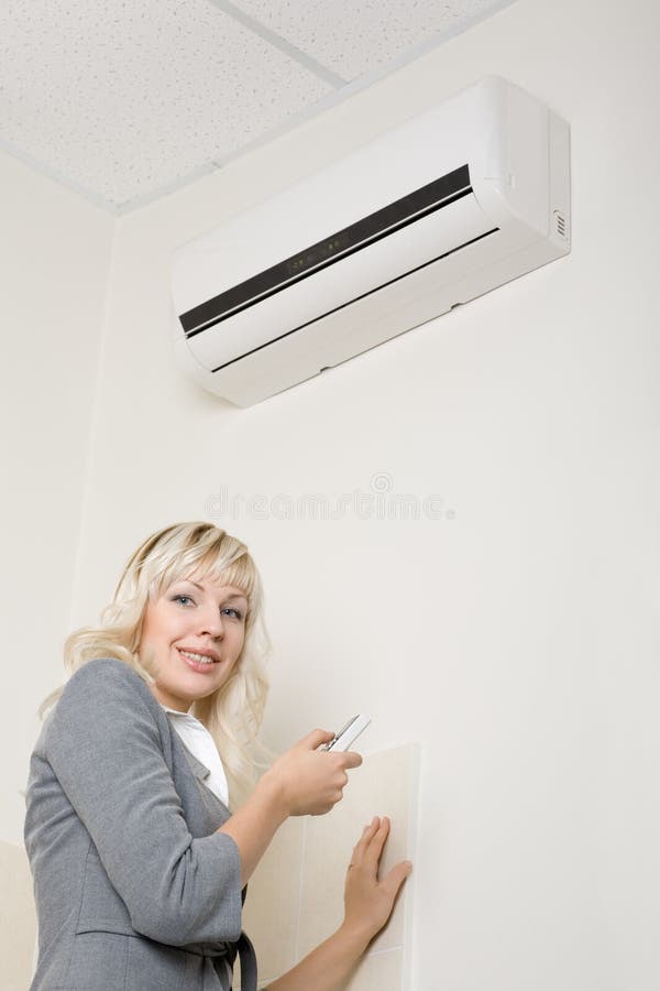 Attractive girl includes air conditioner