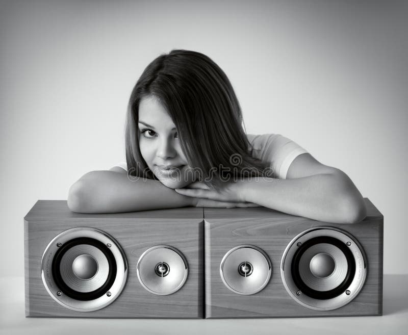 Attractive girl with loudspeakers