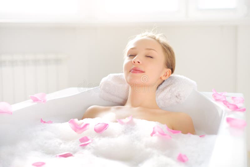 An Attractive girl relaxing in bath