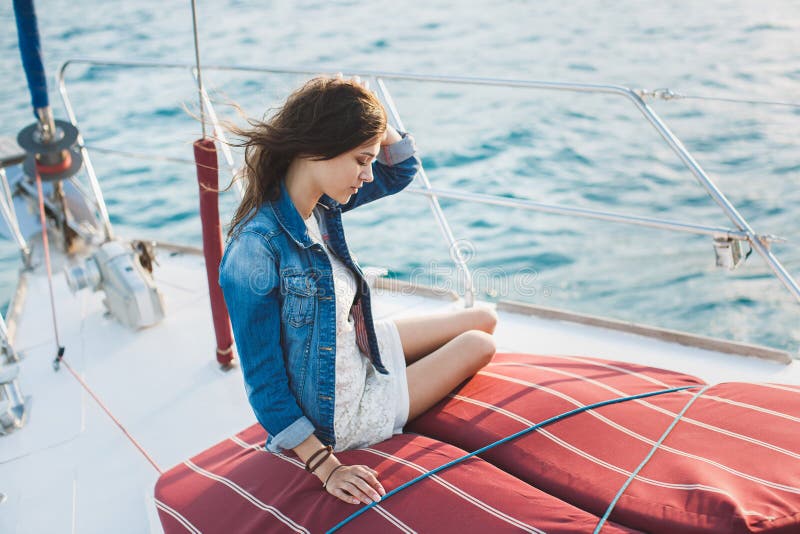 attractive-girl-yacht-sea-176757452.jpg