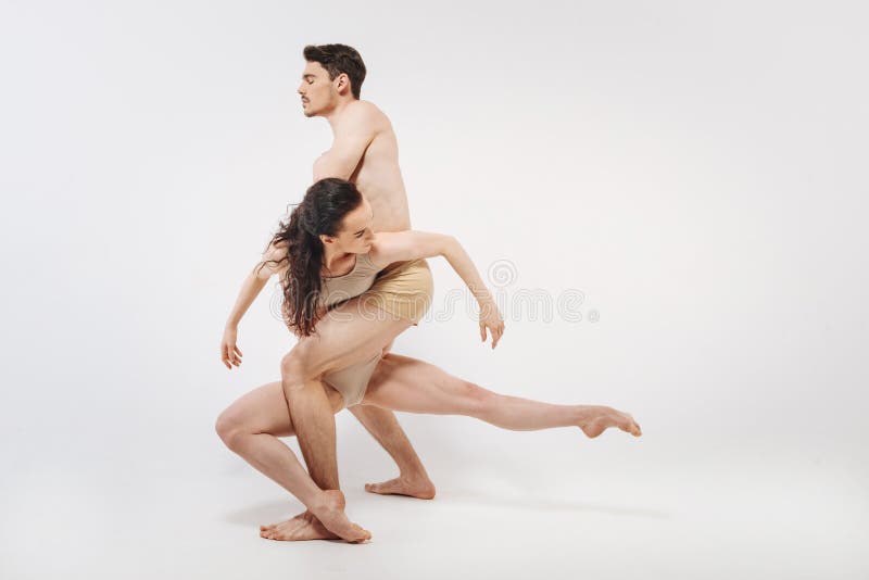 Attractive gymnasts showing their choreography in the studio royalty free stock images
