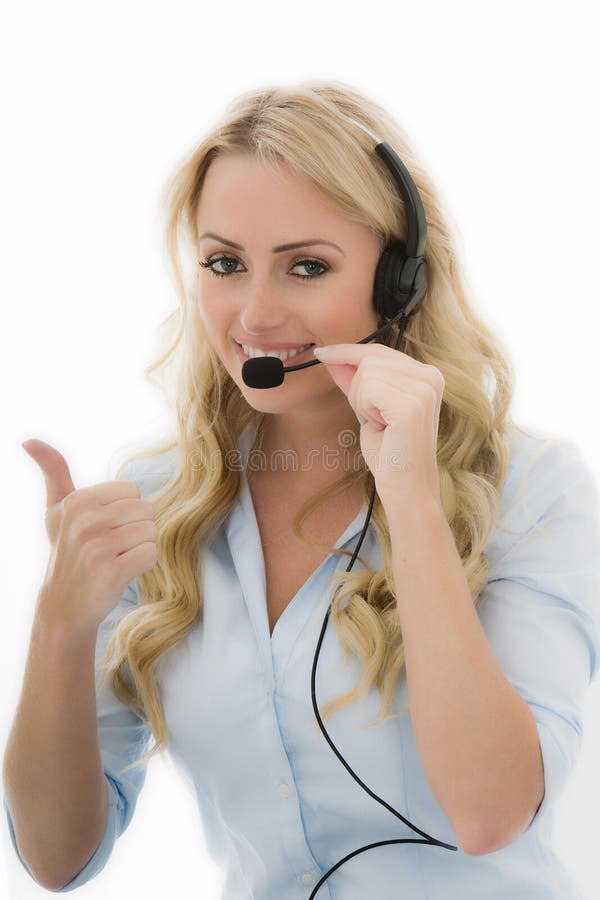 Attractive Happy Young Business Woman, With Long Blonde Wavy Hair, Smiling With Her Thumb Up As Though She Has Finalised a Deal, Using a Telephone Headset Calling Clients, Wearing A Light Blue Shirt Or Blouse, Isolated Against A White Background, Looking Towards The Camera Smiling Happily. Attractive Happy Young Business Woman, With Long Blonde Wavy Hair, Smiling With Her Thumb Up As Though She Has Finalised a Deal, Using a Telephone Headset Calling Clients, Wearing A Light Blue Shirt Or Blouse, Isolated Against A White Background, Looking Towards The Camera Smiling Happily