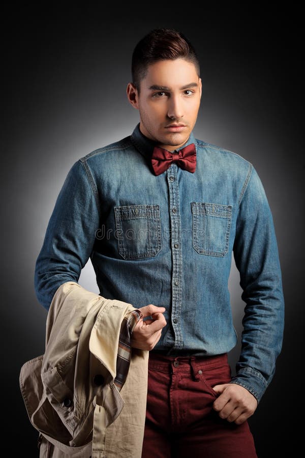 Attractive Male Model Holding Coat and Posing Stock Image - Image of