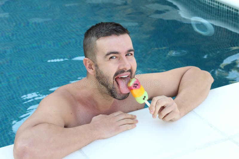 Attractive man licking an ice cream