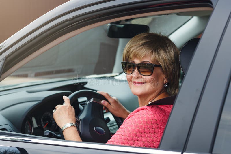 Attractive Mature Woman in a Car Stock Image - Image of head, active ...