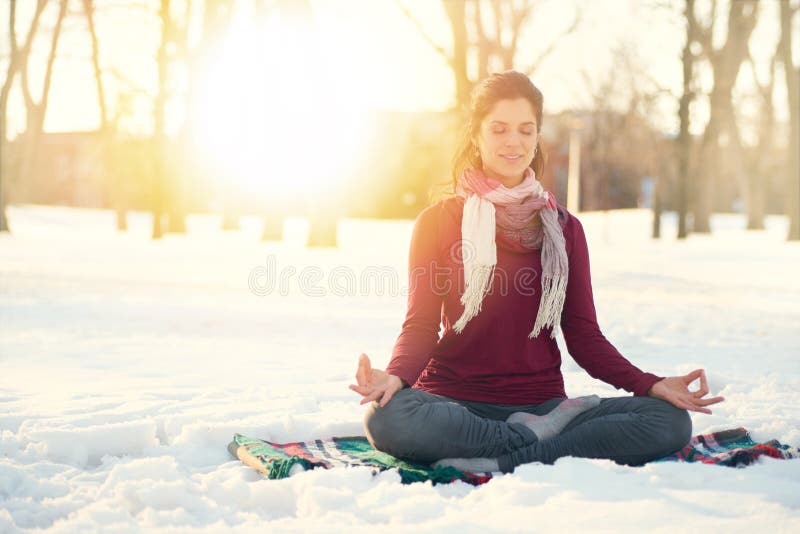 Attractive mixed race woman doing yoga in nature at winter time stock photos Attractive mixed race woman doing yoga in nature at winter time stock photos