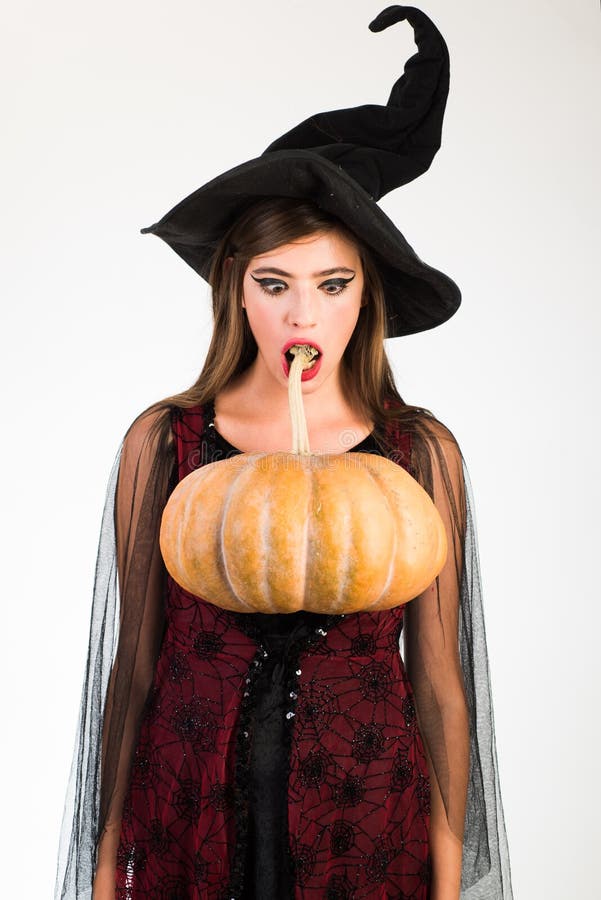 Attractive model girl in Halloween costume. Expression face - surprised woman. Happy young women in witch halloween. Attractive model girl in Halloween costume stock photo Attractive model girl in Halloween costume. Expression face - surprised woman. Happy young women in witch halloween. Attractive model girl in Halloween costume stock photo