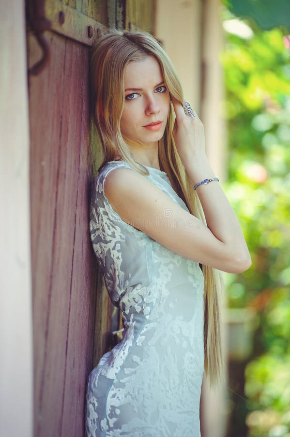 Attractive Modest Young Blond Woman on Red Wooden Background Her Hair ...