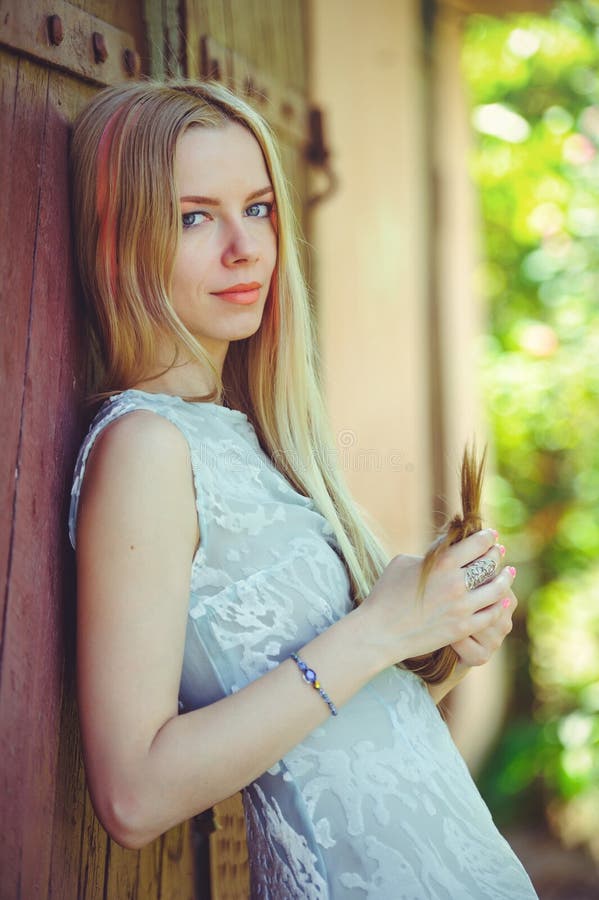 Attractive Modest Young Blond Woman on Red Wooden Background Her Hair ...