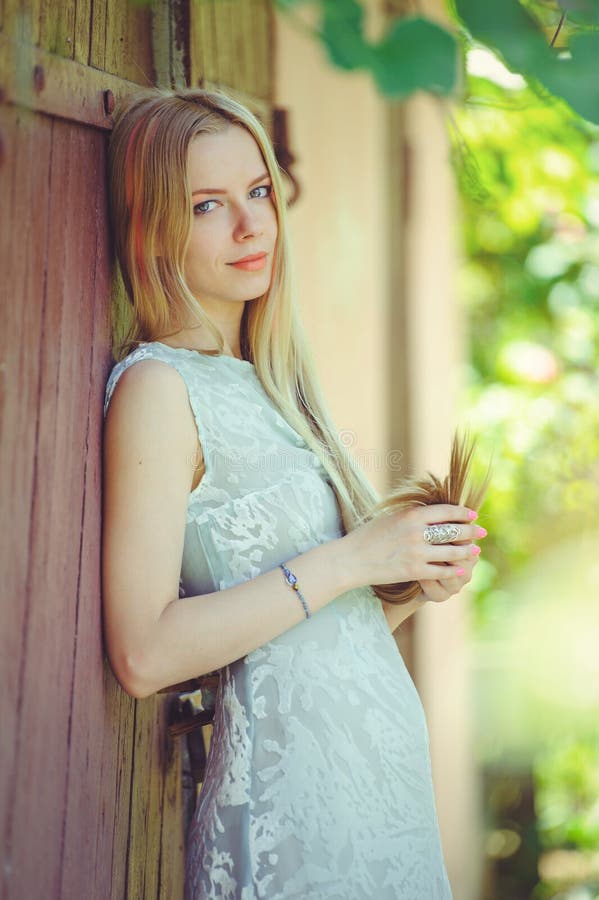 Attractive Modest Young Blond Woman on Red Wooden Background Her Hair ...