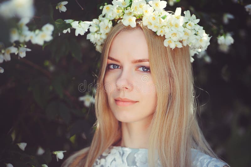 Attractive Modest Young Girl with Blonde with Jasmine Flowers Wreath on  Head Long Hair and Natural Make-up in White Dress Outdoors Stock Image -  Image of model, flora: 114575389