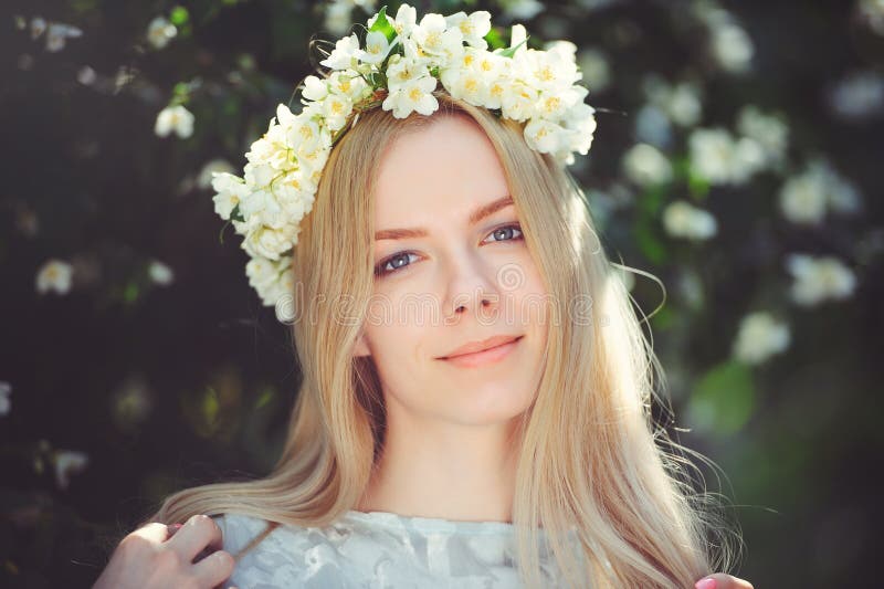 Attractive Modest Young Girl with Blonde with Jasmine Flowers Wreath on  Head Long Hair and Natural Make-up in White Dress Outdoors Stock Photo -  Image of garden, blonde: 114575444