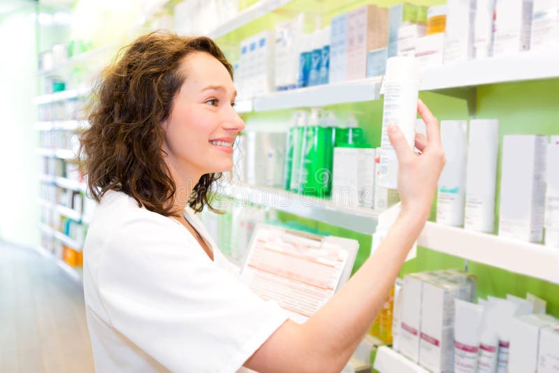Attractive Pharmacist Clean the Store Up Stock Image Image of green