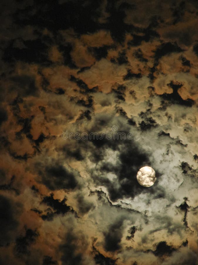 The night sky and a bright full moon among mystical clouds stock images The night sky and a bright full moon among mystical clouds stock images