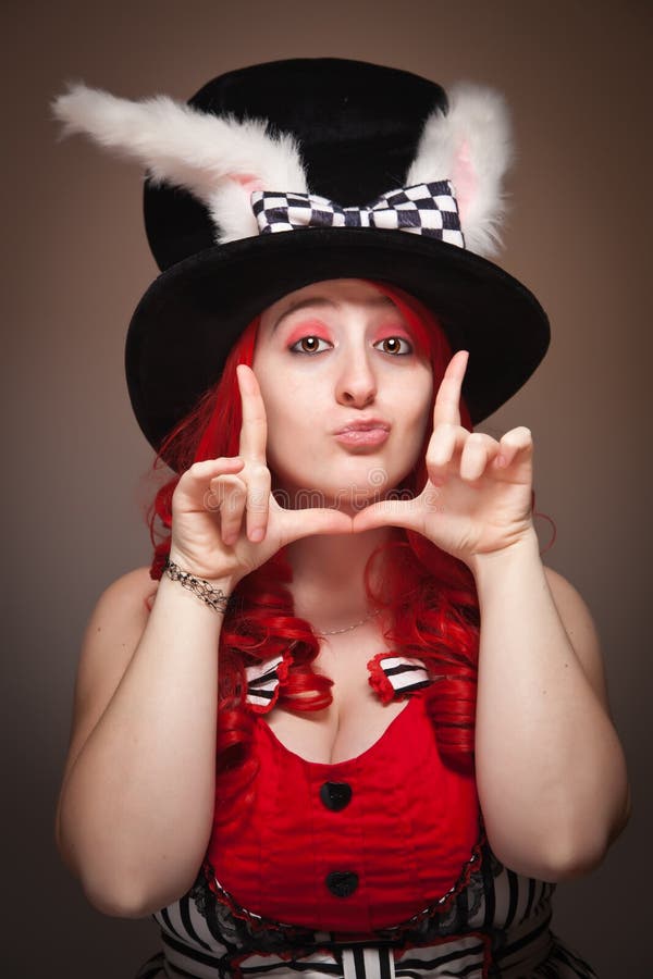 Attractive Red Haired Woman Wearing Bunny Ear Hat