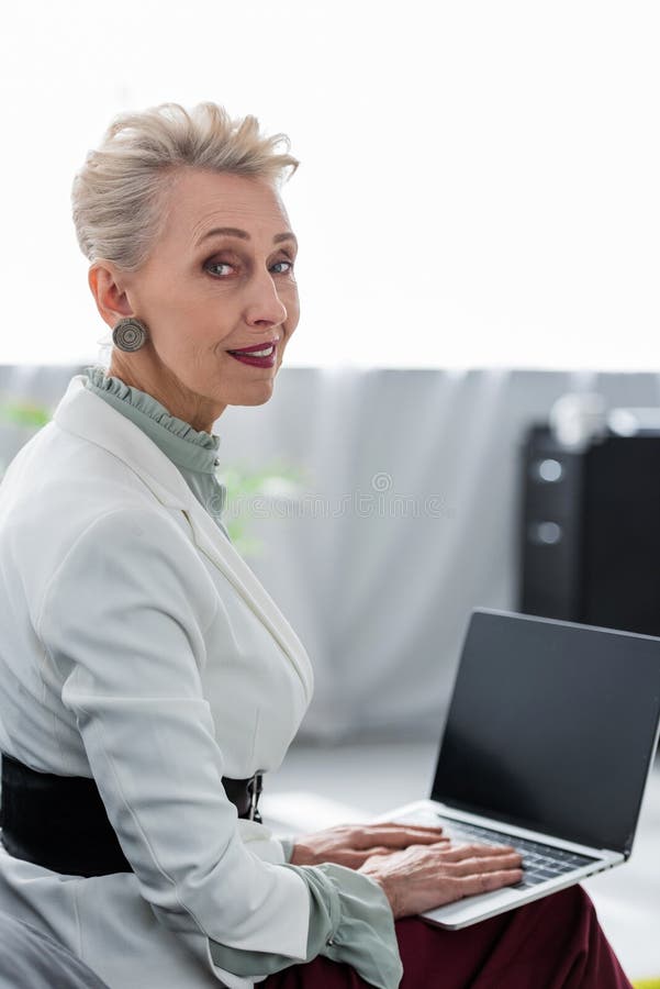 attractive senior business woman using laptop royalty free stock image attractive senior business woman using laptop royalty free stock image