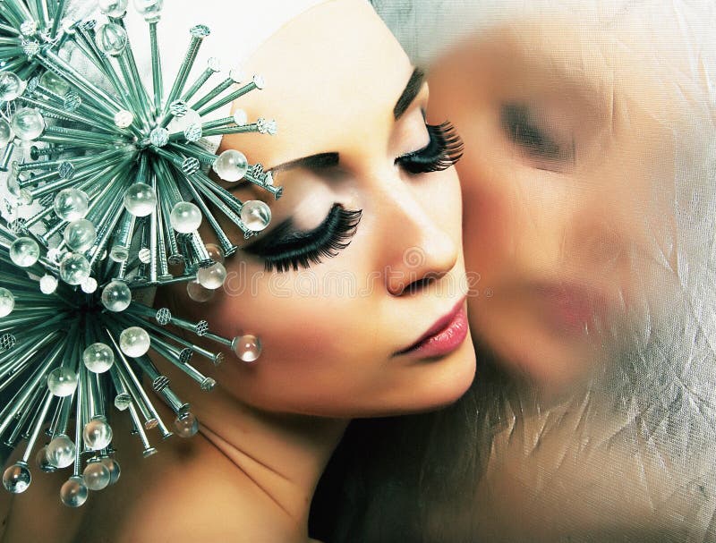 Attractive sensual girl reflects in mirror.