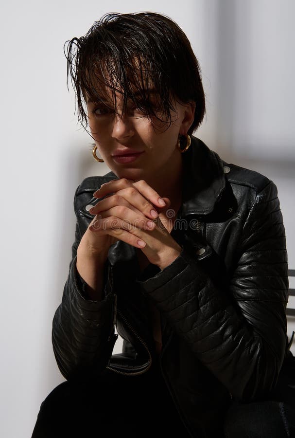 Attractive Young Brunette with Short Wet Hairstyle Wearing an Eco Leather Black Jacket, Poses Looking at Camera, Isolated on Stock Photo - Image of beauty, person: 231103966 Attractive Young Brunette with Short Wet Hairstyle Wearing an Eco Leather Black Jacket, Poses Looking at Camera, Isolated on Stock Photo - Image of beauty, person: 231103966