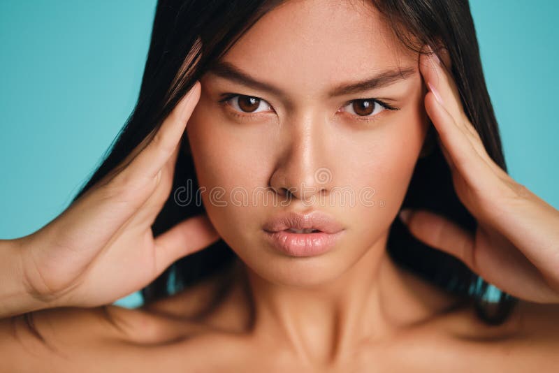 Attractive Serious Asian Brunette Girl Intently Looking In Camera Over 