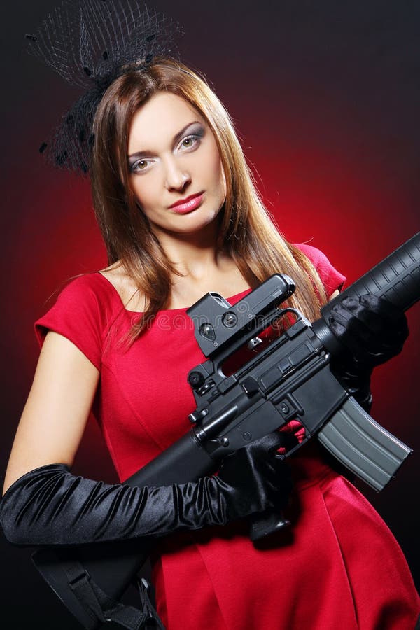 Attractive and spy woman with assault rifle