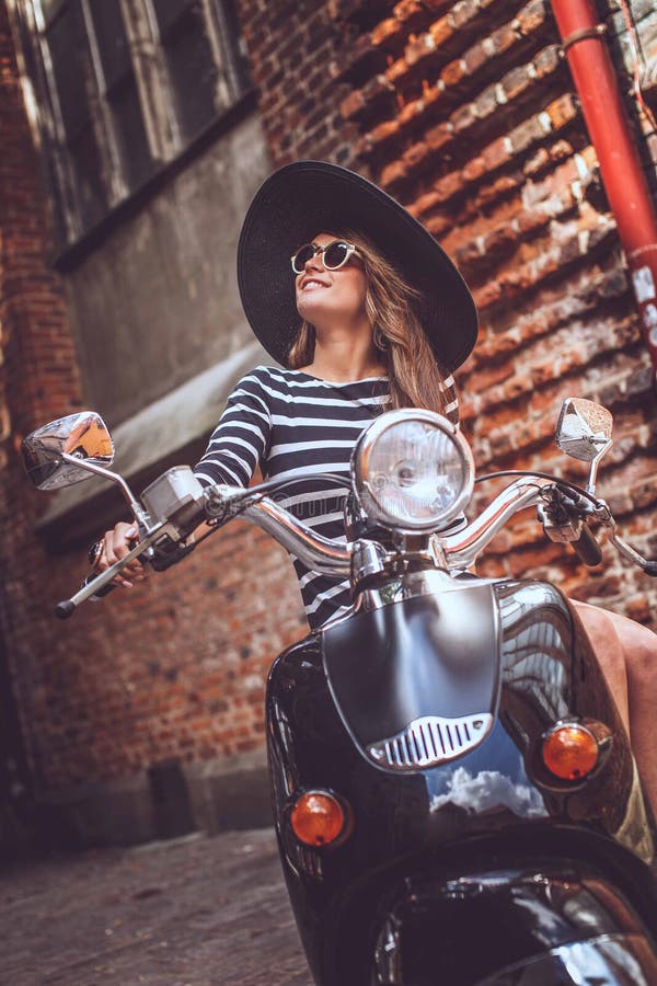 Sexy Good Looking Girl Posing On Stylish Scooter. Stock Photo, Picture and  Royalty Free Image. Image 44904925.