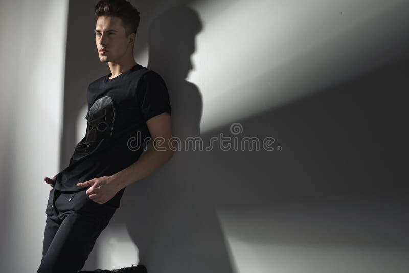 Attractive Slim Man Leaning Against the Wall Stock Image - Image of ...