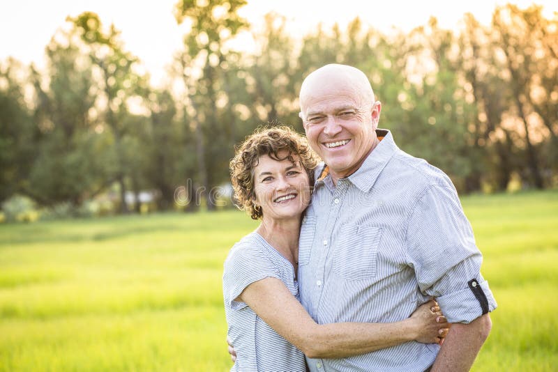 Attractive Smiling Mature couple portrait outdoors stock photos Attractive Smiling Mature couple portrait outdoors stock photos