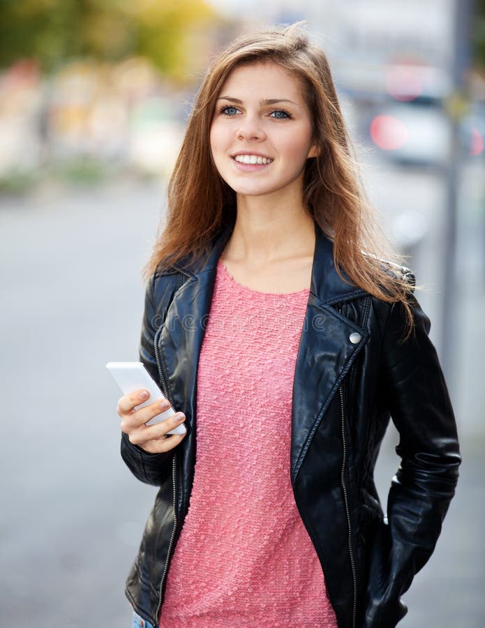 Attractive student using her smart phone