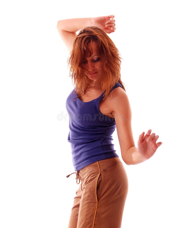 Attractive teenage dancing over white background