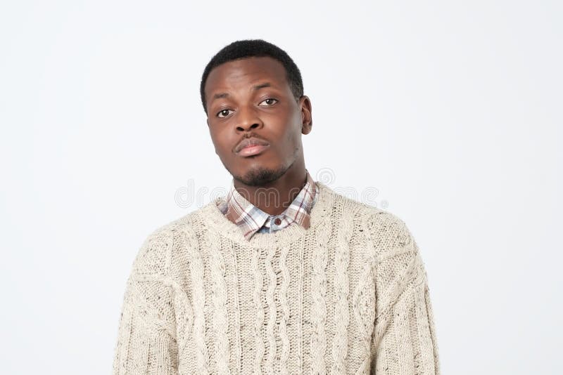 unhappy black young man over white background. Close up portrait royalty free stock image unhappy black young man over white background. Close up portrait royalty free stock image