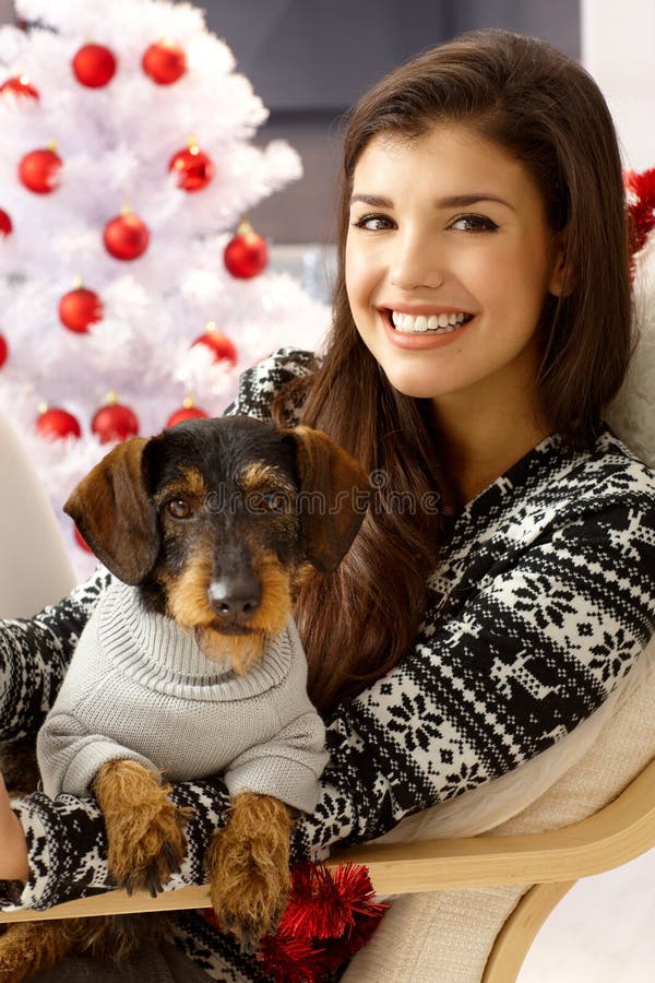 Attractive woman with dog at xmas