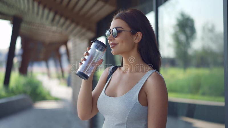 Attractive woman drinking water