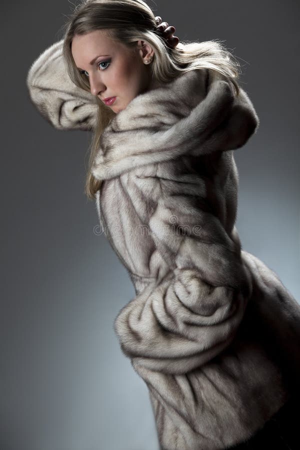 Attractive woman in fur coat