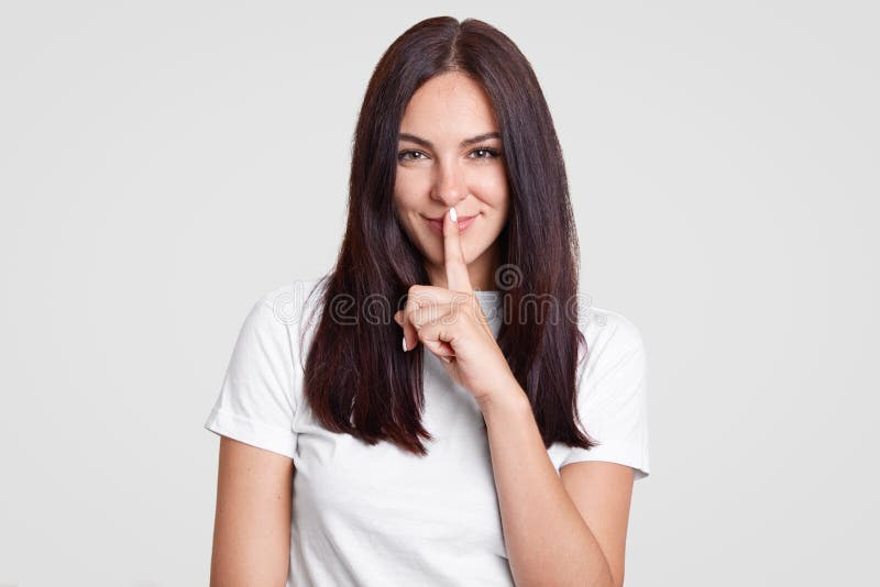 Attractive Woman With Long Dark Hair Has Secret Keeps Fore Finger Over