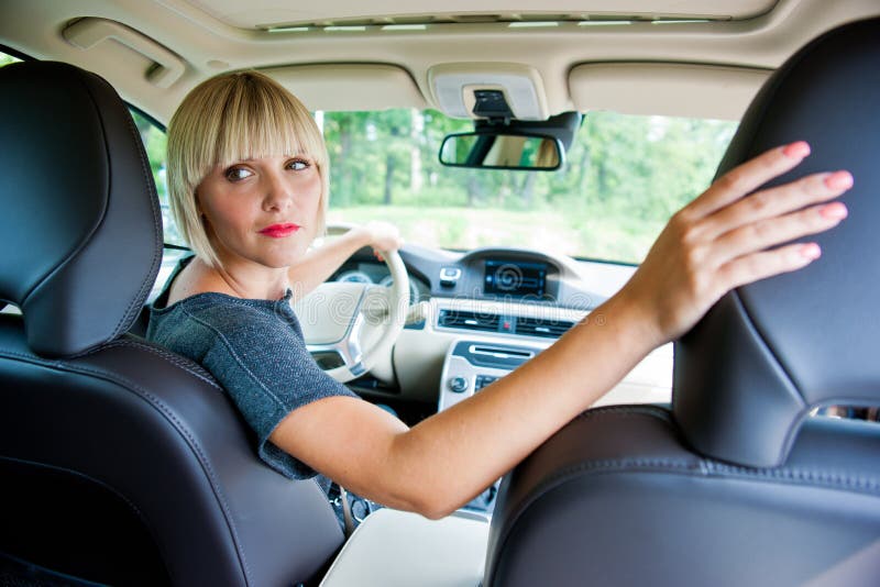 Attractive woman parking her car stock image Attractive woman parking her car stock image