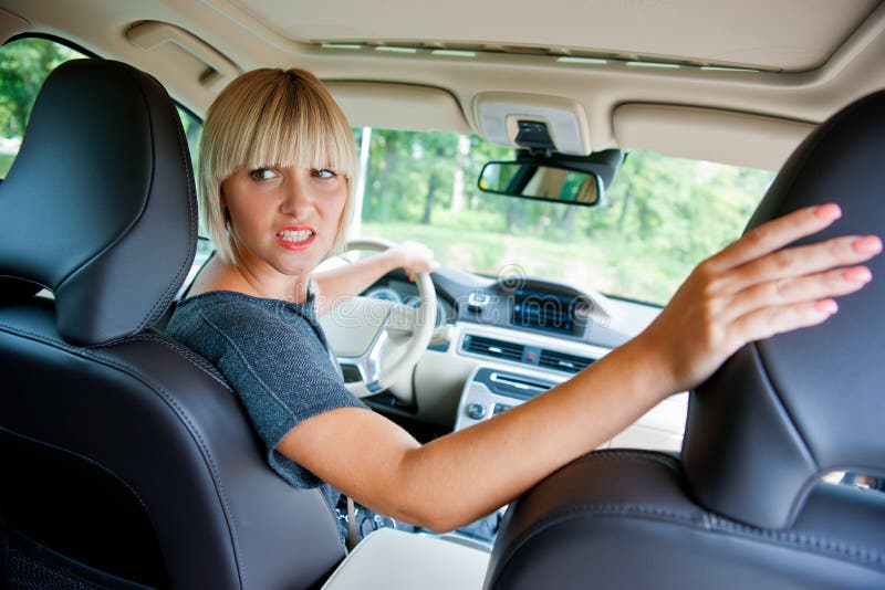 Attractive woman parking her car