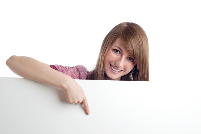 Attractive woman pointing blank sign. Smiling.