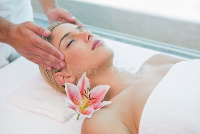 Attractive Woman Receiving Head Massage At Spa Center Stock Image