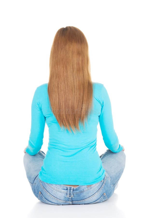 Attractive woman sitting. Back view. stock photography