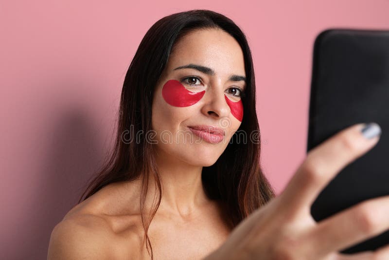 Attractive Woman Taking Selfie On Her Camera With Under Eye Patches Beauty Blogger Stock Image